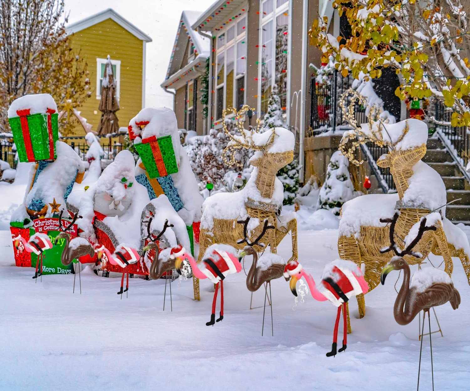 GiftExpress flamingo on porch grouped with holiday décor for cheerful styling