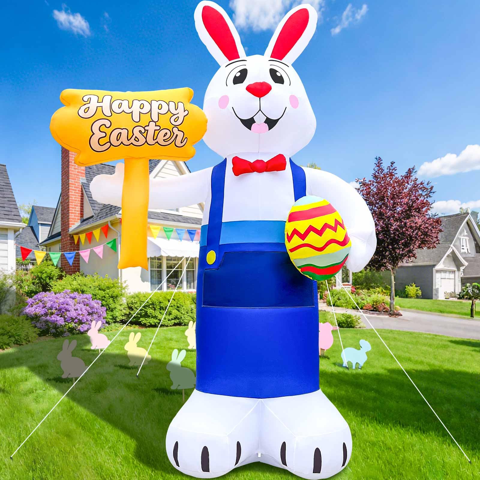 GIGLIM family posing with inflatable on lawn showing festive, photo-ready moment