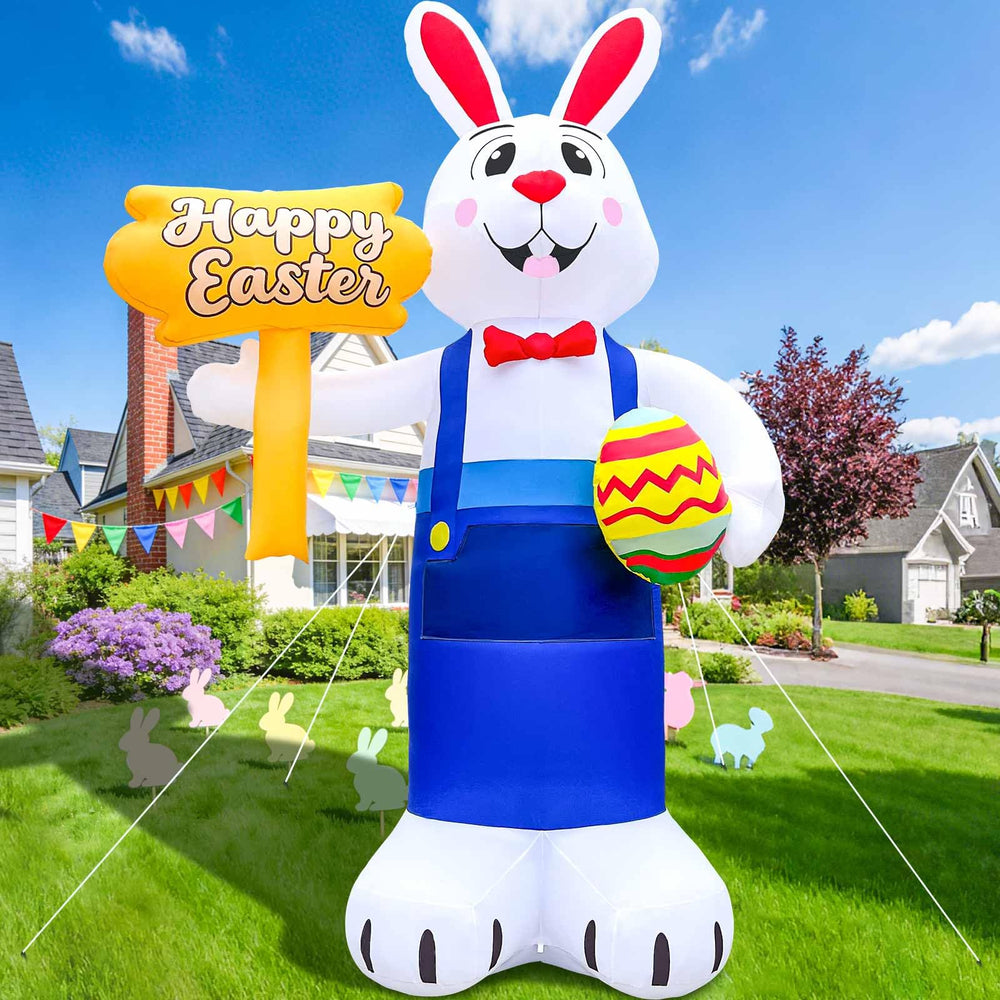 GIGLIM family posing with inflatable on lawn showing festive, photo-ready moment