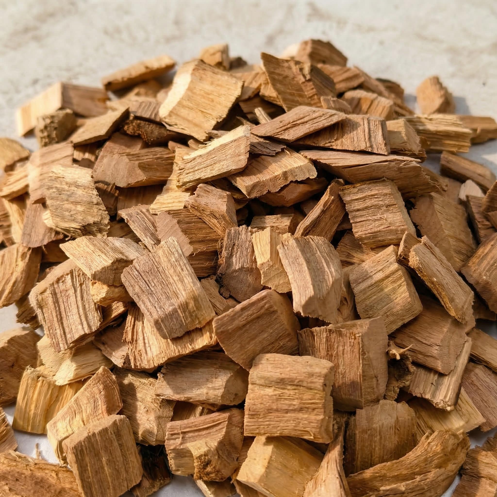 Gimgsoen wood chips in a smoker box producing steady smoke for flavor
