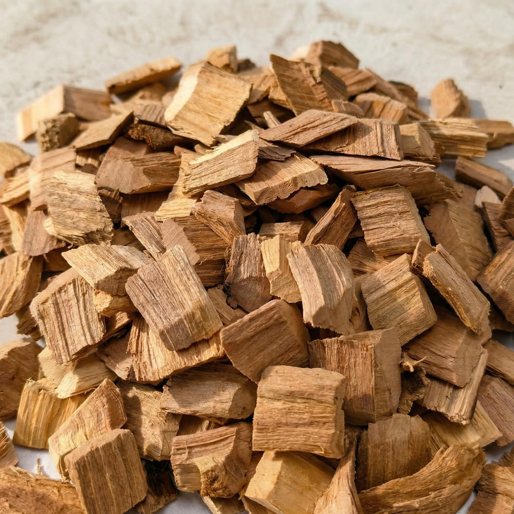 Gimgsoen wood chips in a smoker box producing steady smoke for flavor