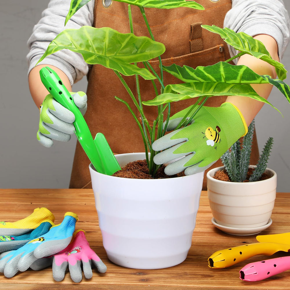 Gisafai mini trowel and glove in child’s hands digging soil to encourage outdoor learning