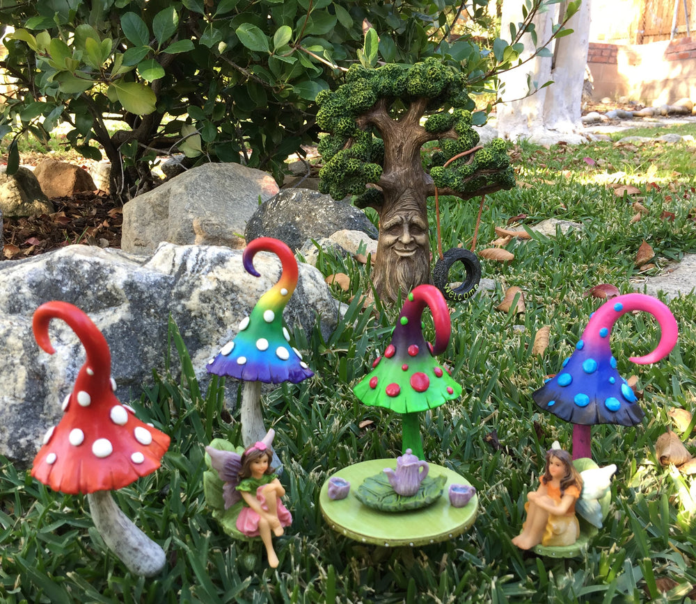 GlitZGlam tree staged in a fairy garden showing how it anchors miniature scenes
