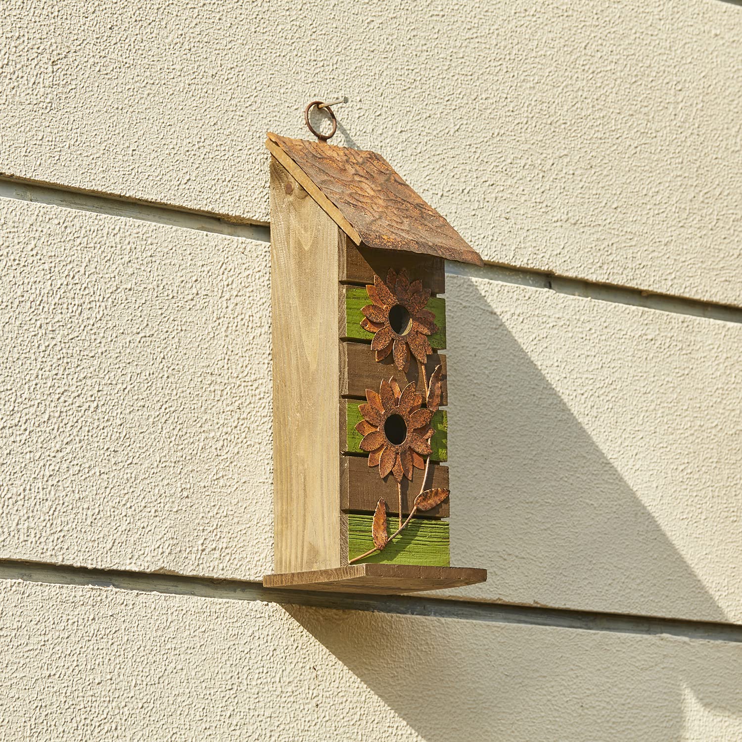 Glitzhome bird house on a porch adding rustic charm to outdoor decor