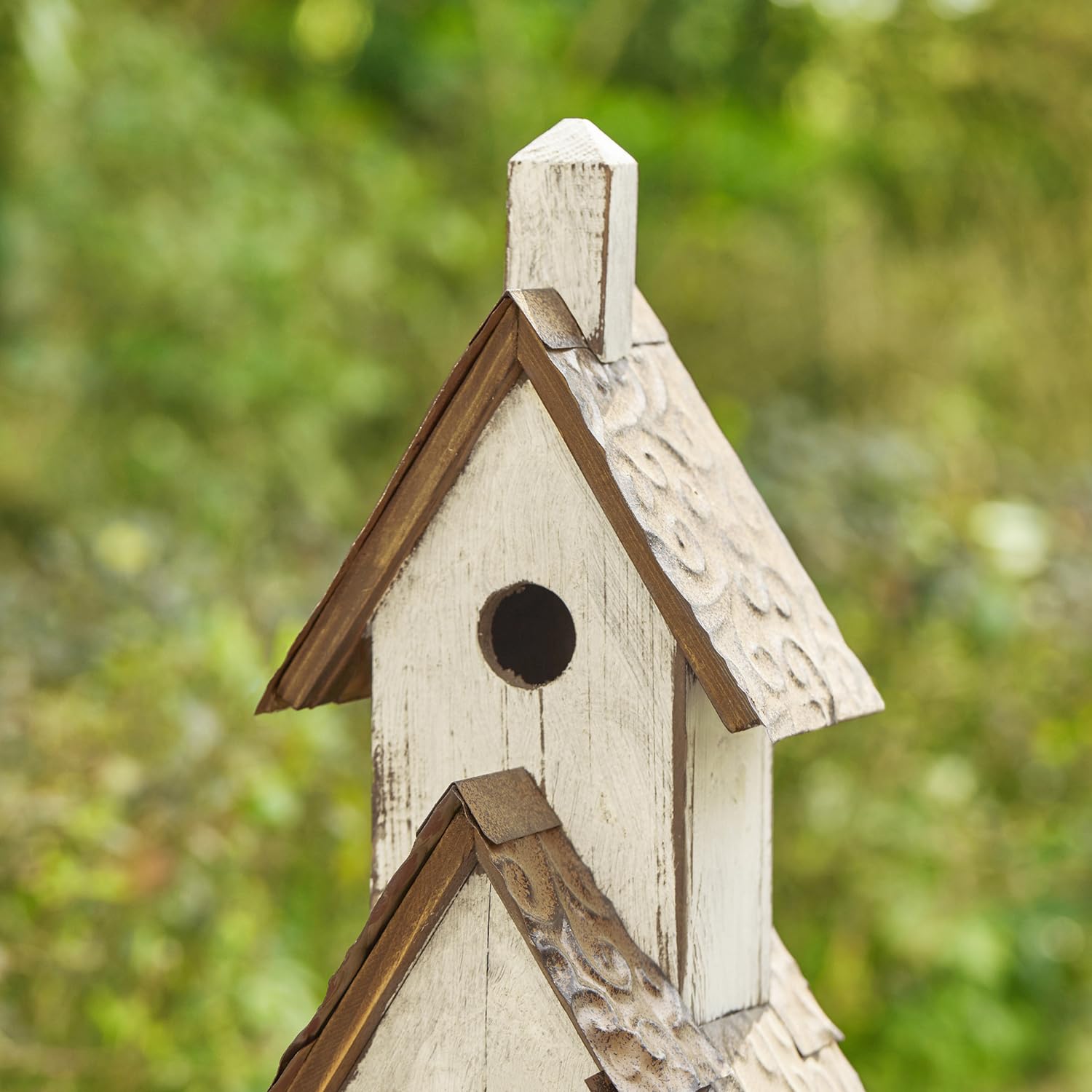 Glitzhome birdhouse staged in garden adding cottage-style focal point