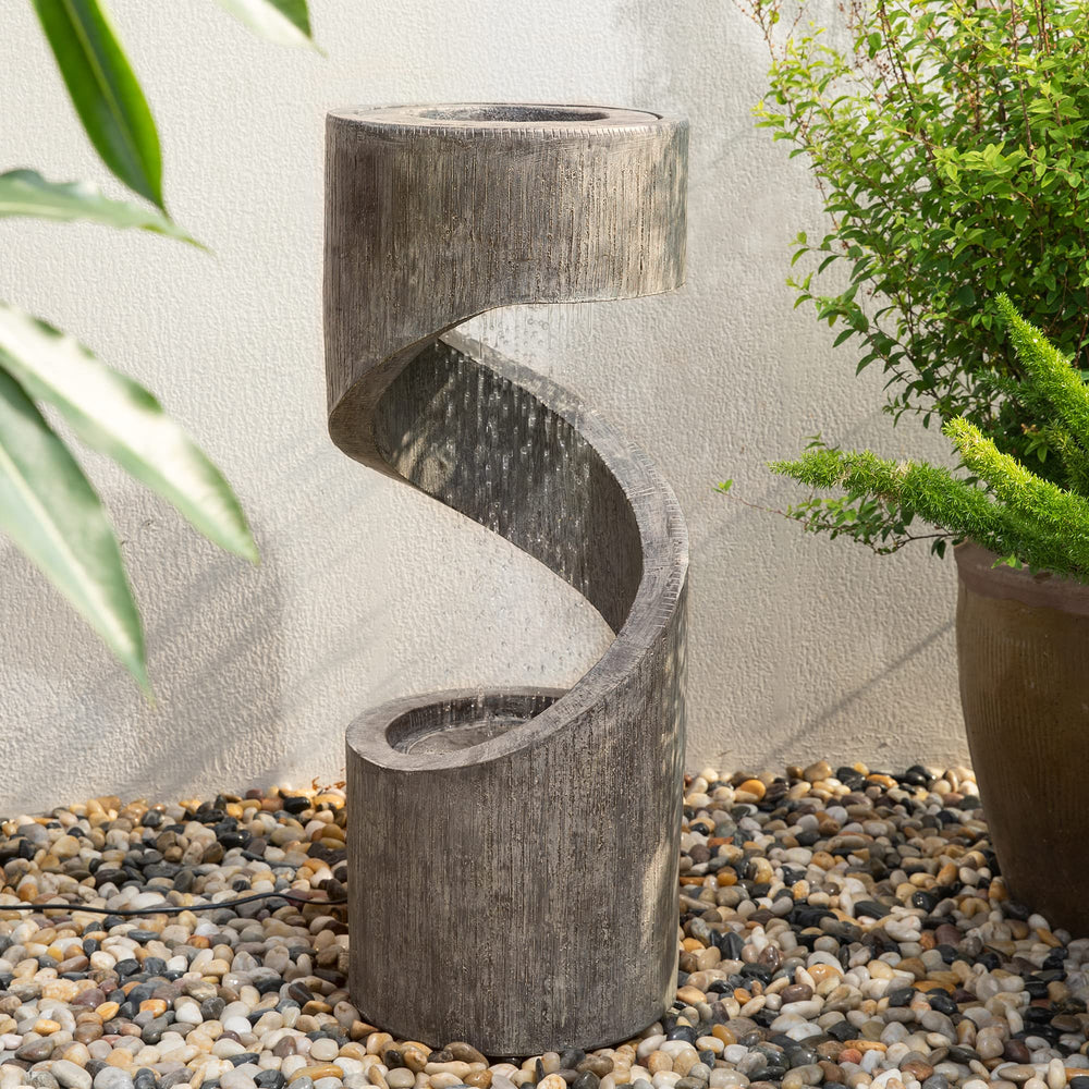 Glitzhome evening backyard setting with glowing fountain, enhances nighttime outdoor ambiance
