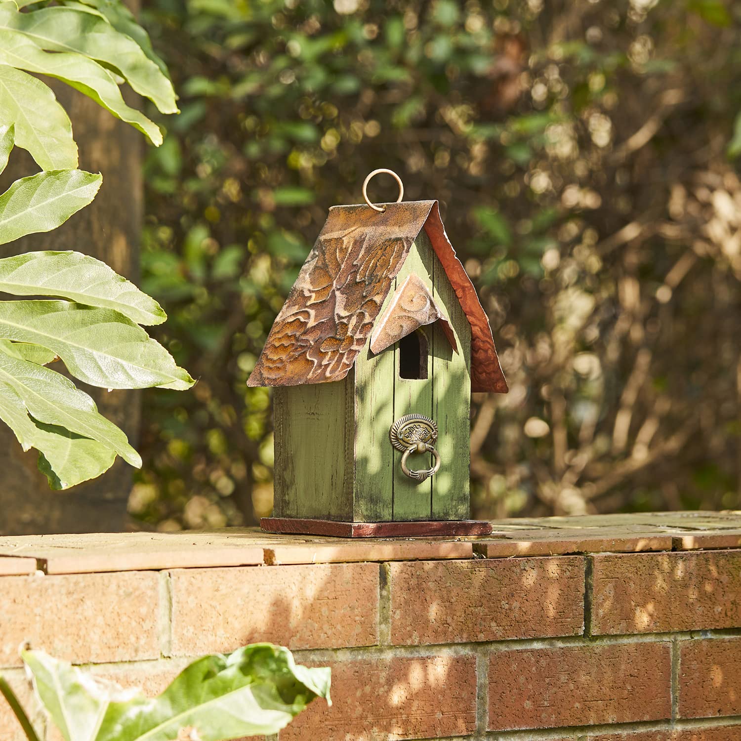 Glitzhome hung on tree branch in garden attracting small birds benefit