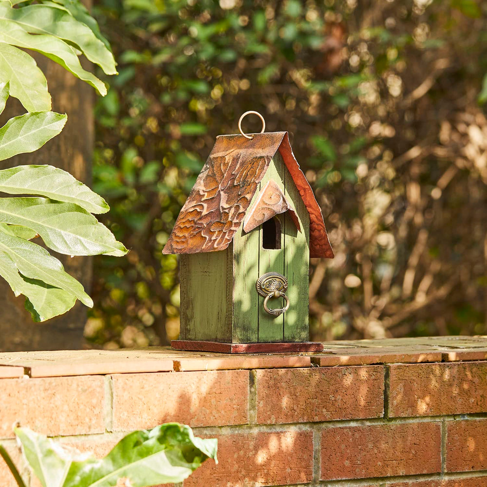 Glitzhome hung on tree branch in garden attracting small birds benefit