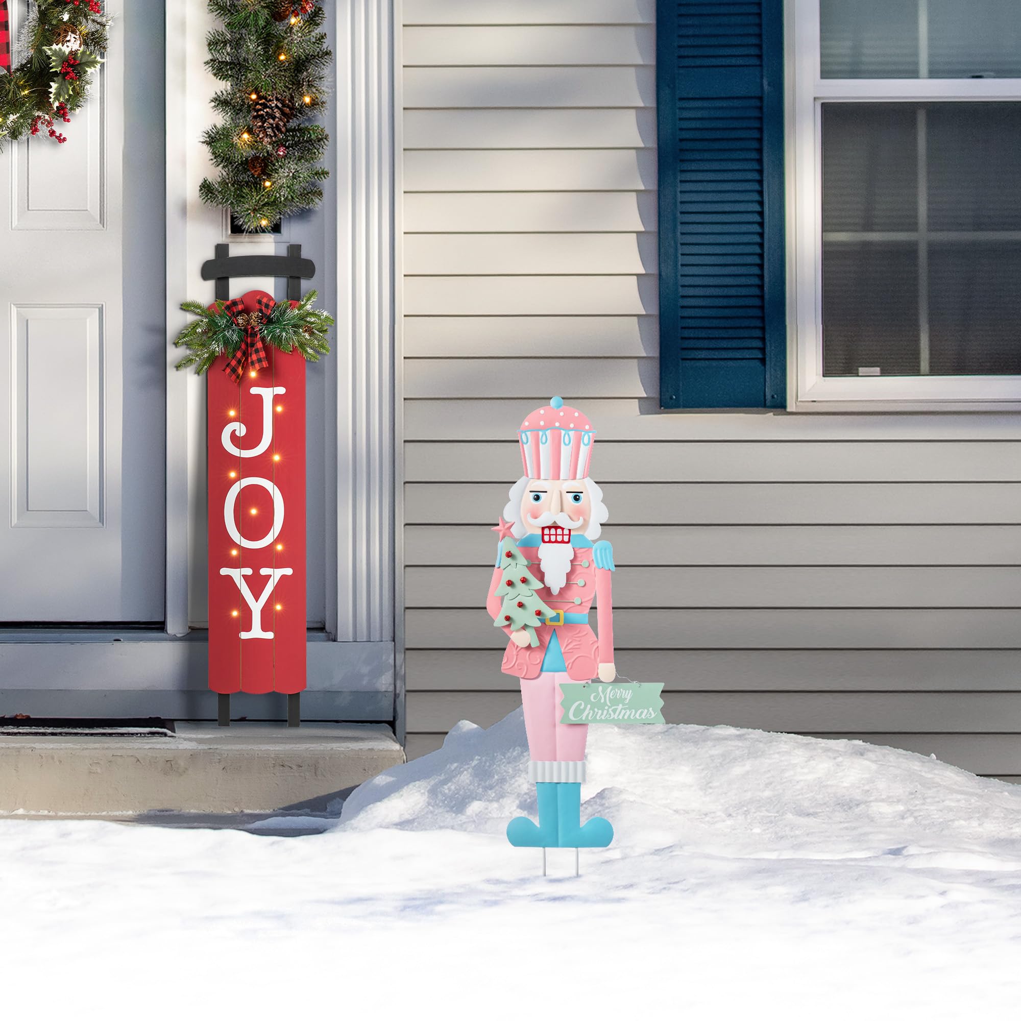 Glitzhome nutcracker beside doorway illustrating 36-inch scale and visual impact