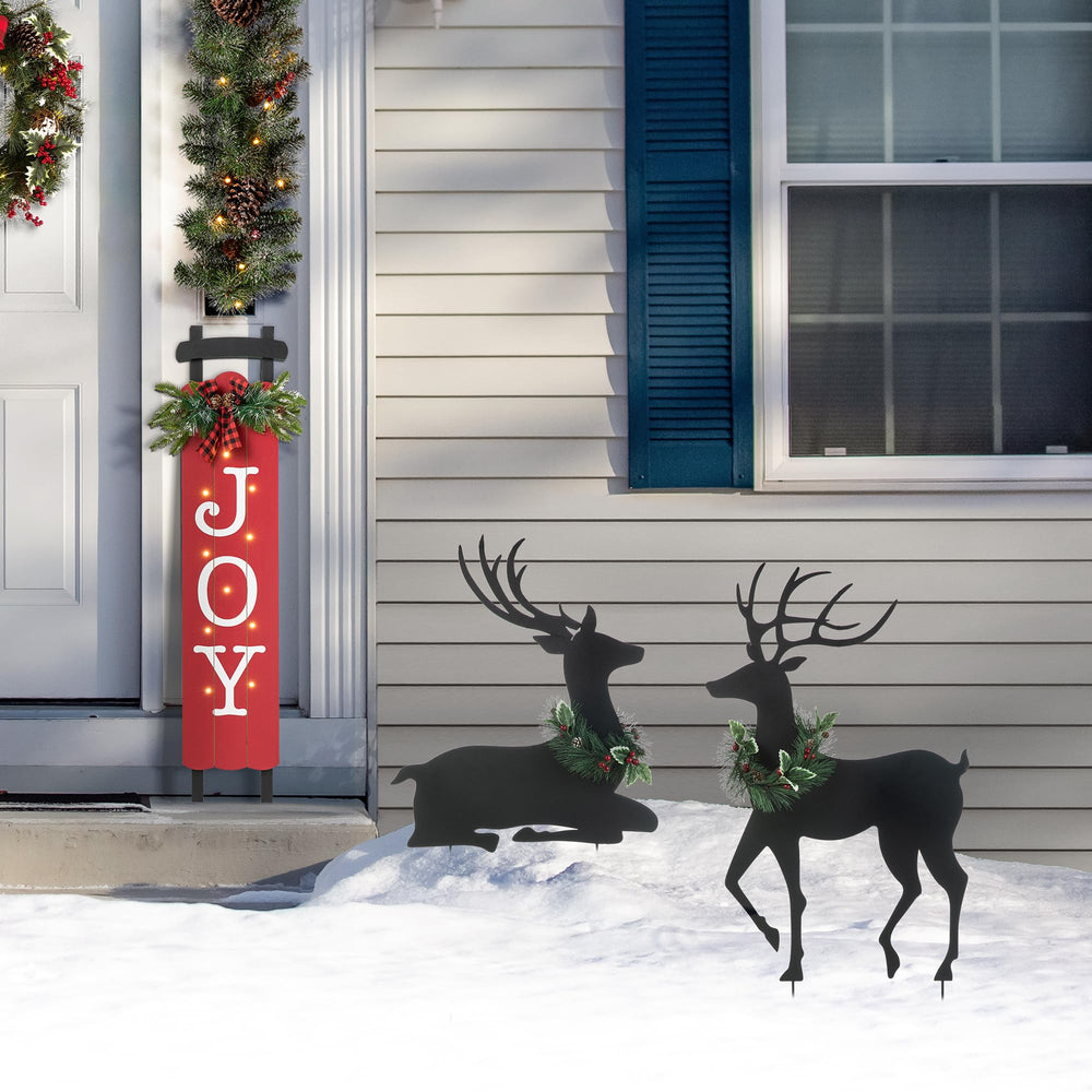 Glitzhome styled on a porch entryway offering welcoming holiday decor