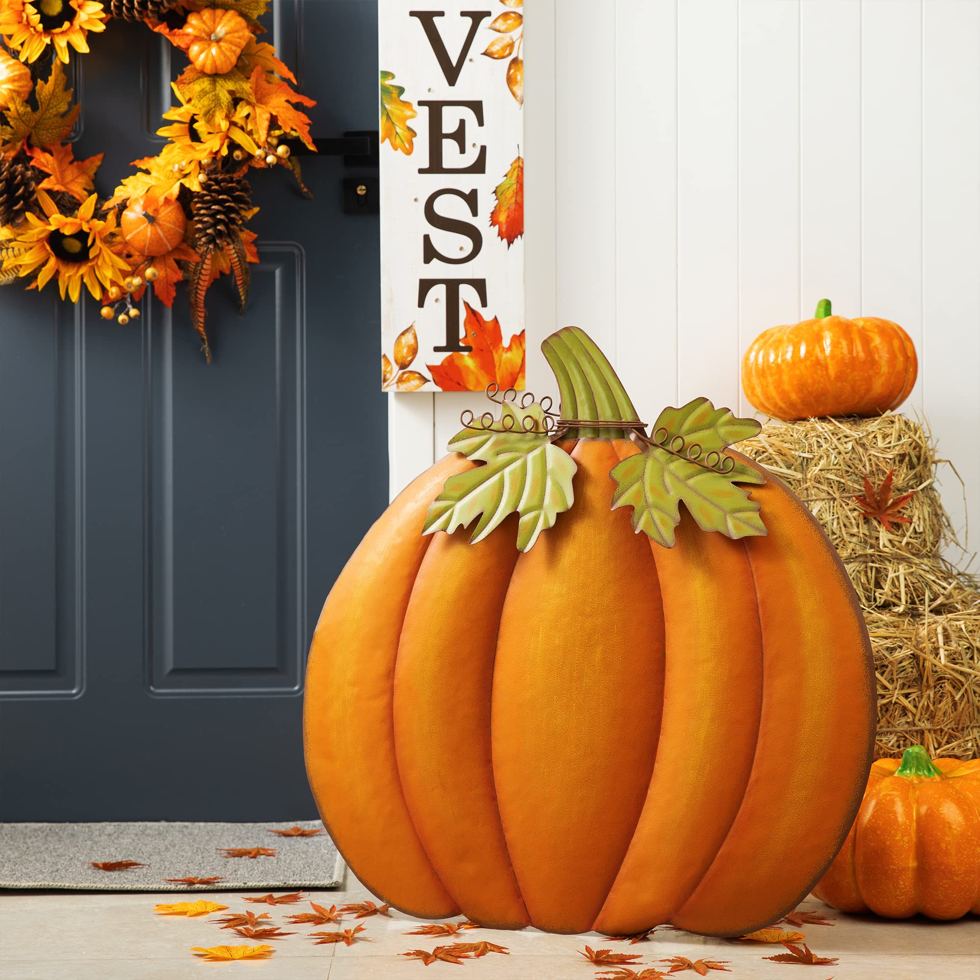 Glitzhome pumpkin hanging on a front door adding warm seasonal charm