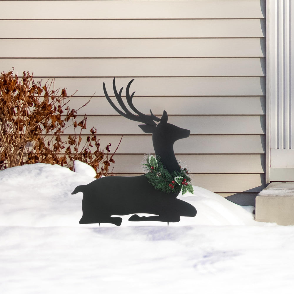 Glitzhome reindeer next to yard tools to show height and scale advantage