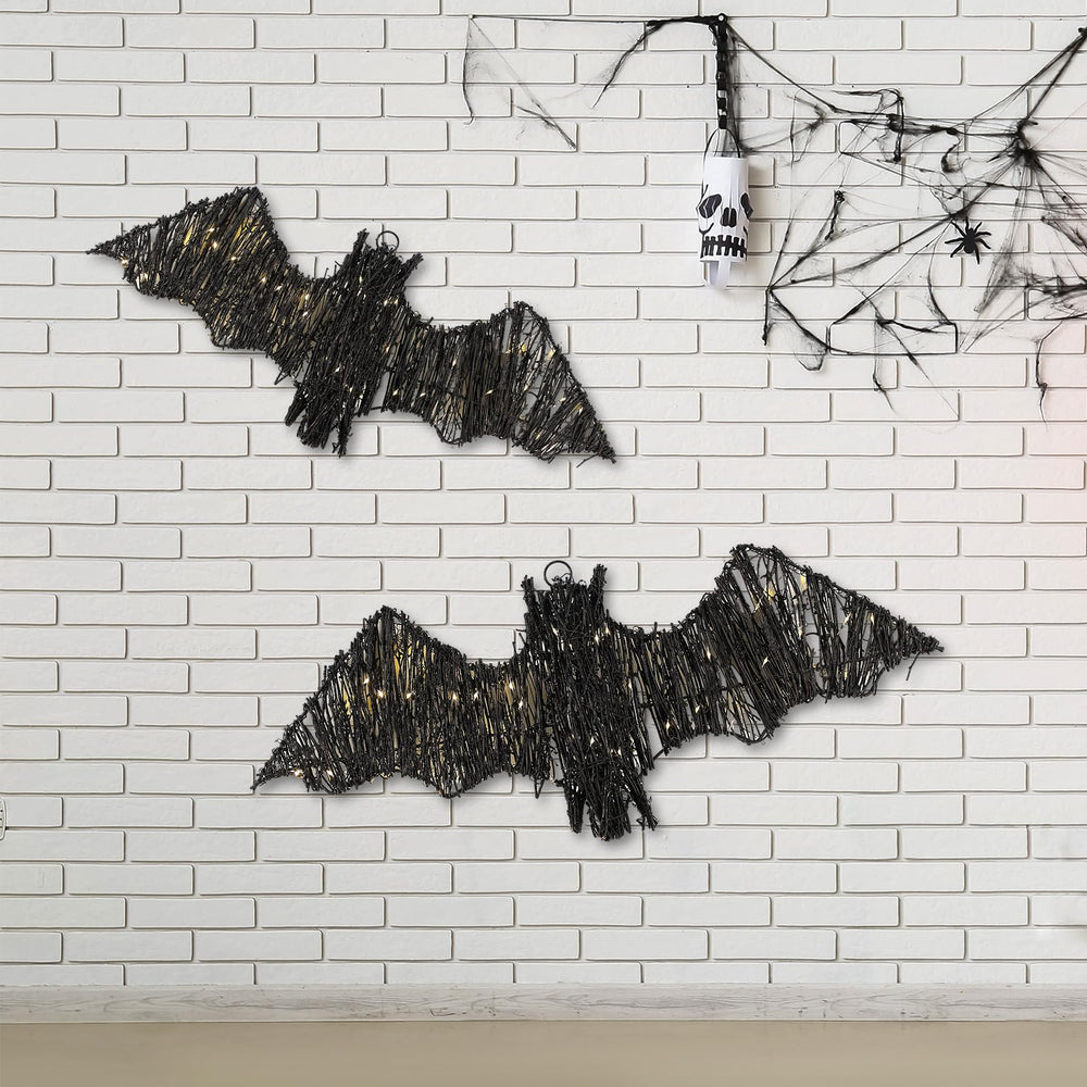 Glooglitter bats lit on a porch at night creating ambient spooky lighting