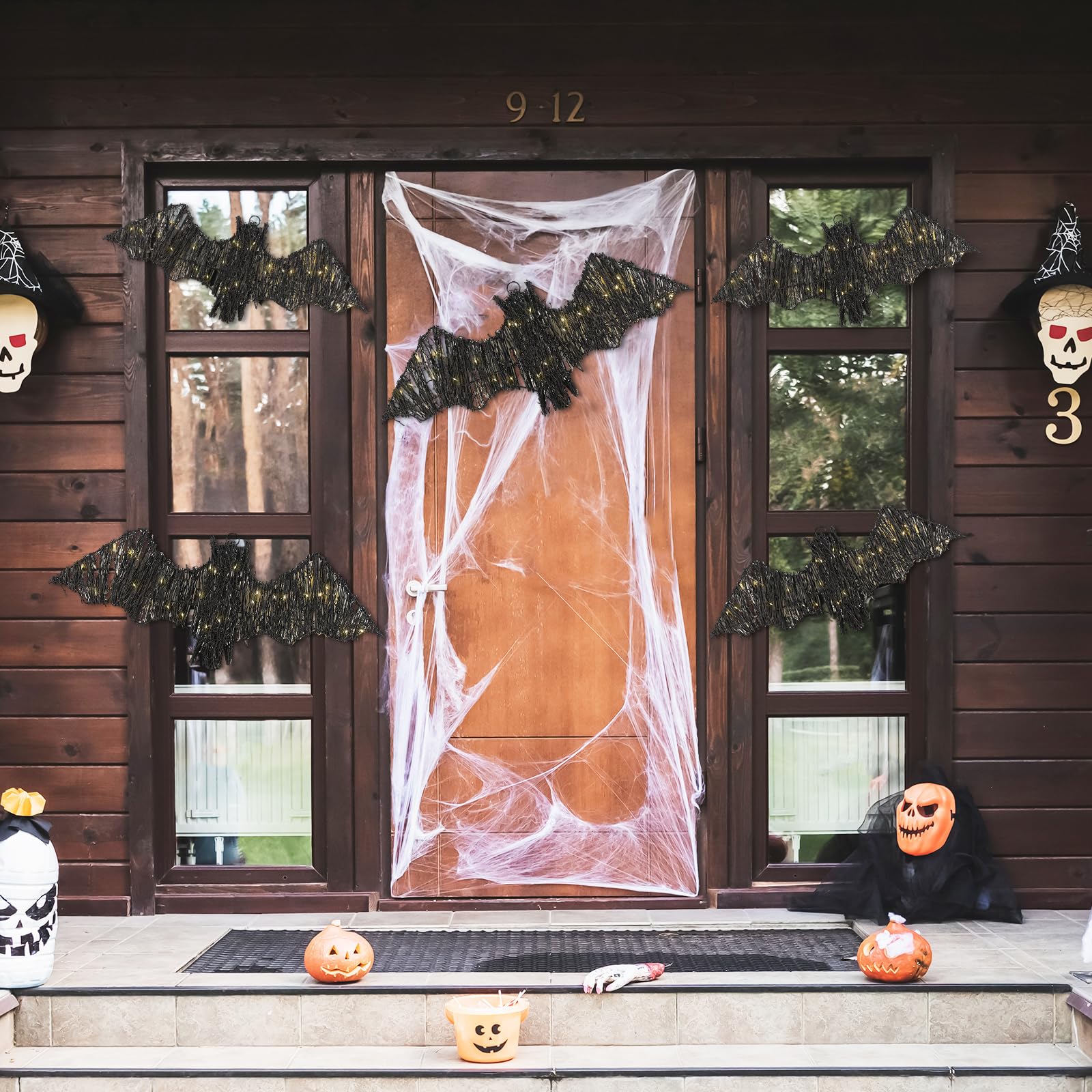 Glooglitter styled on a mantel with warm lights for rustic Halloween mood