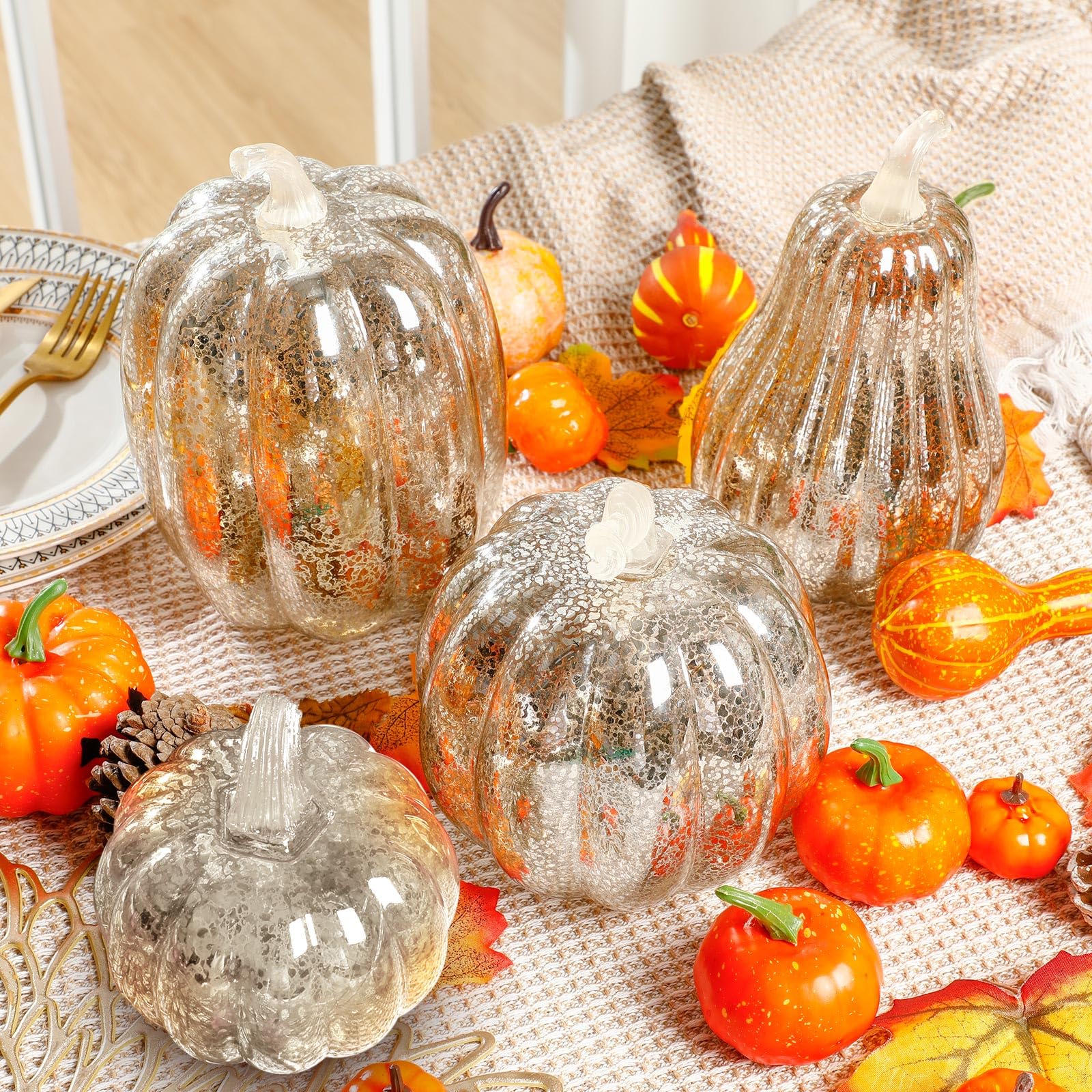Glooglitter lit pumpkins on a dining table creating warm centerpiece glow and cozy ambiance benefit