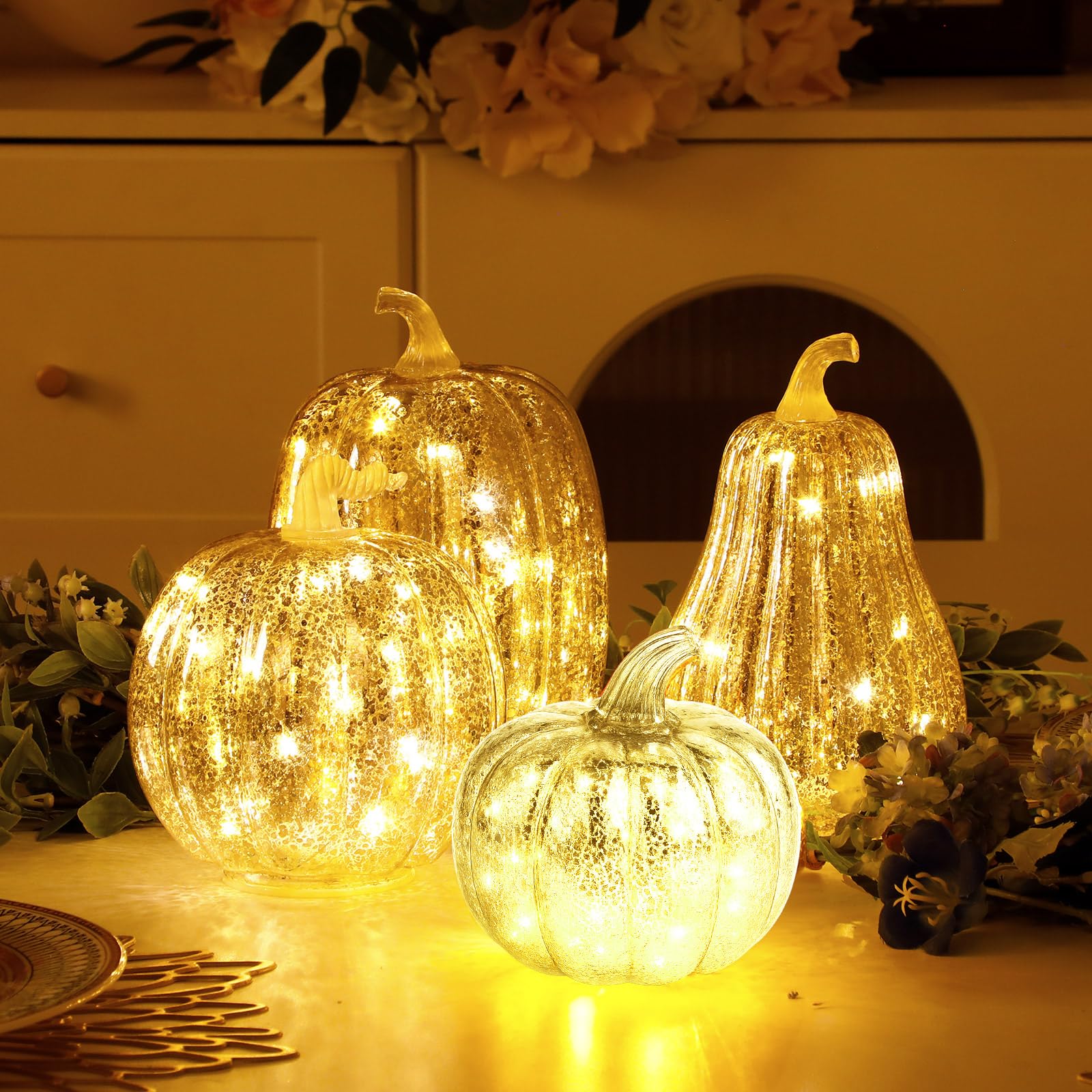 Glooglitter pumpkins next to a book and teacup illustrating scale and layered styling benefit