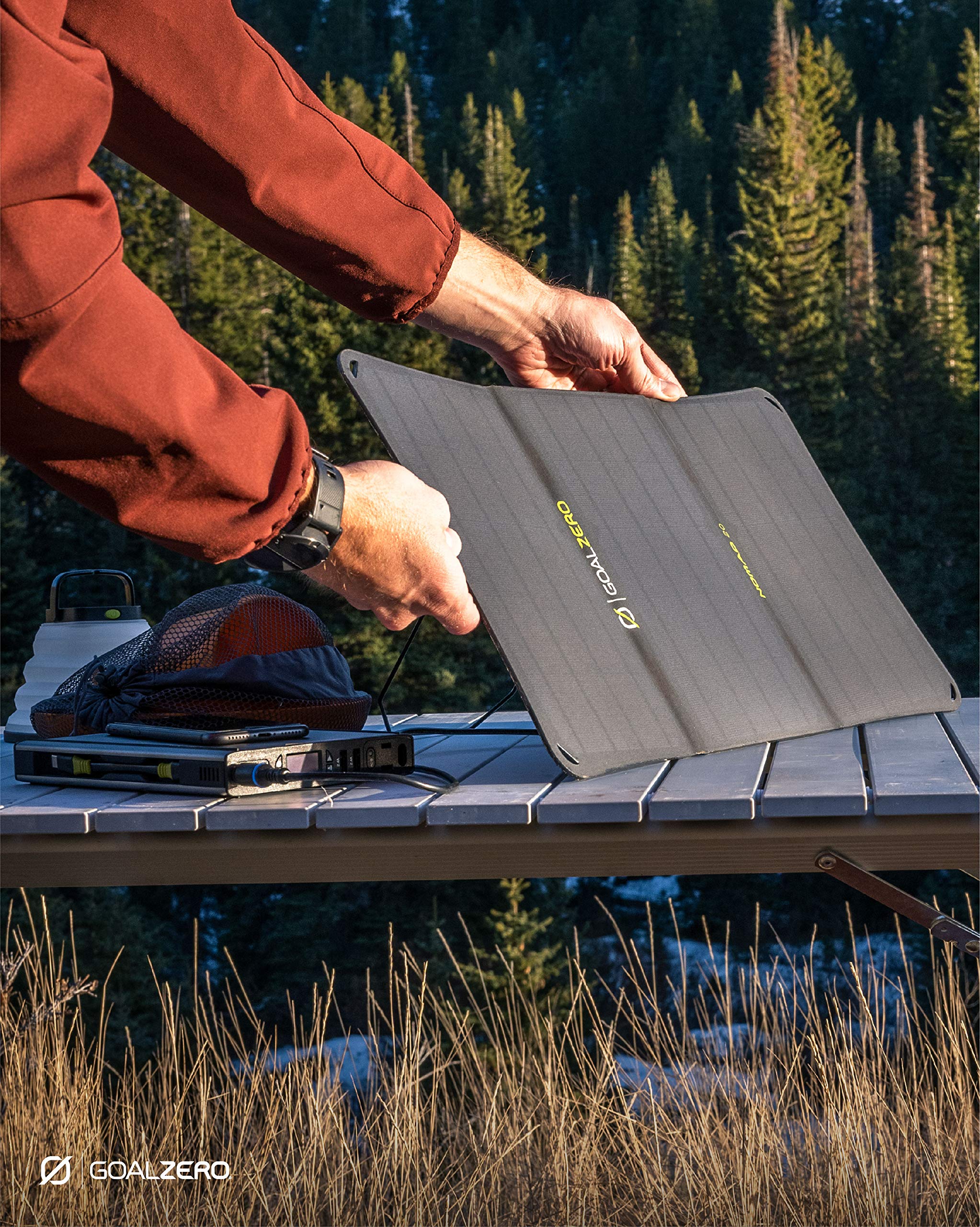 Goal Zero Nomad 20 powering devices at a campsite illustrating practical outdoor use