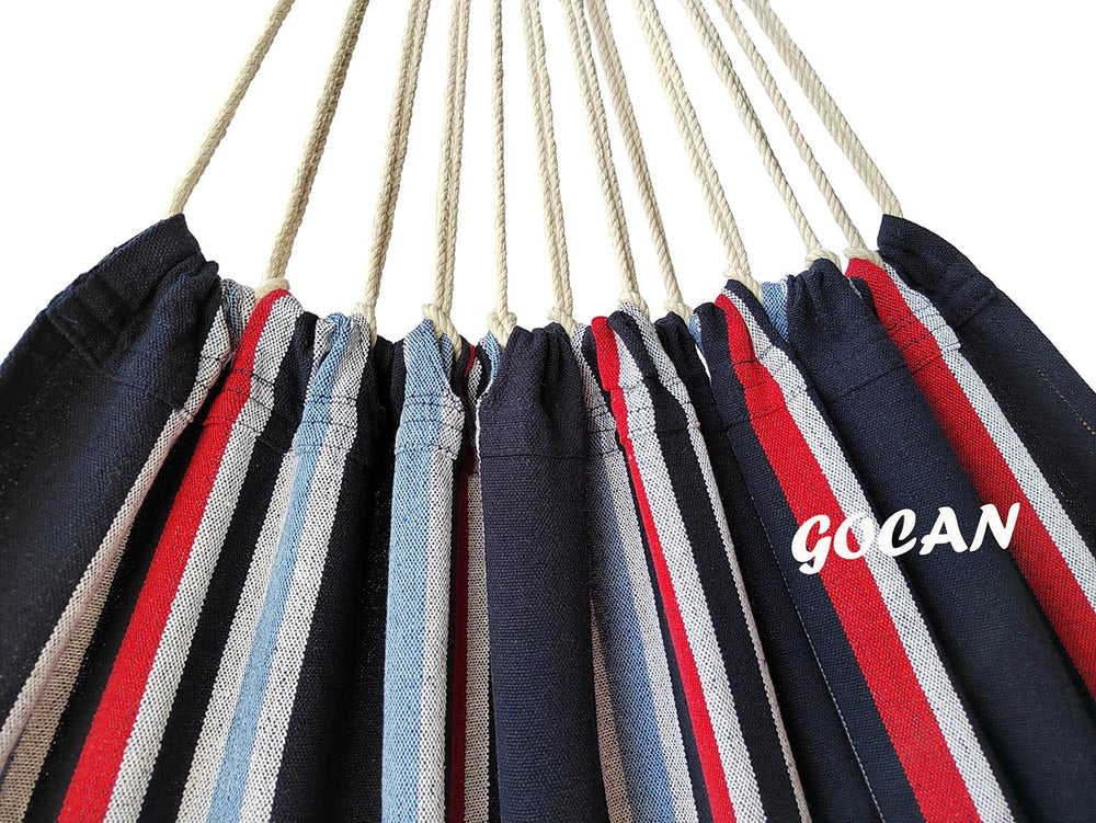 GOCAN hammock in backyard with couple relaxing to show use