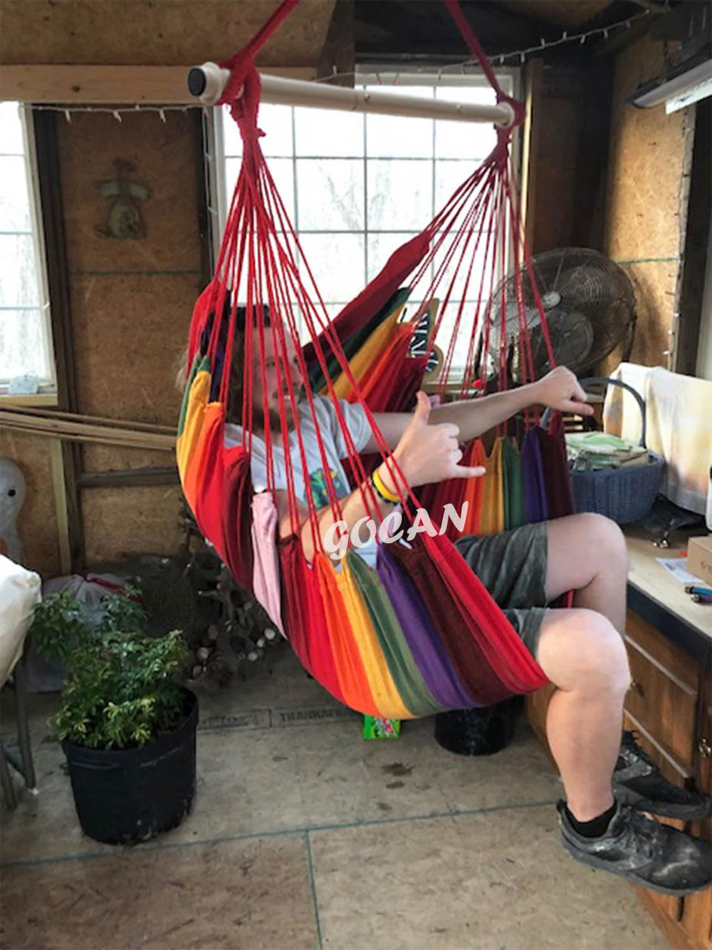 GOCAN hammock in lifestyle scene with person relaxing showing cozy retreat