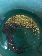 Goldn Paydirt being panned in a gold pan illustrating technique and faster separation of heavy material