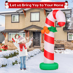 GOOSH inflatable candy cane installed on a lawn adding holiday curb appeal