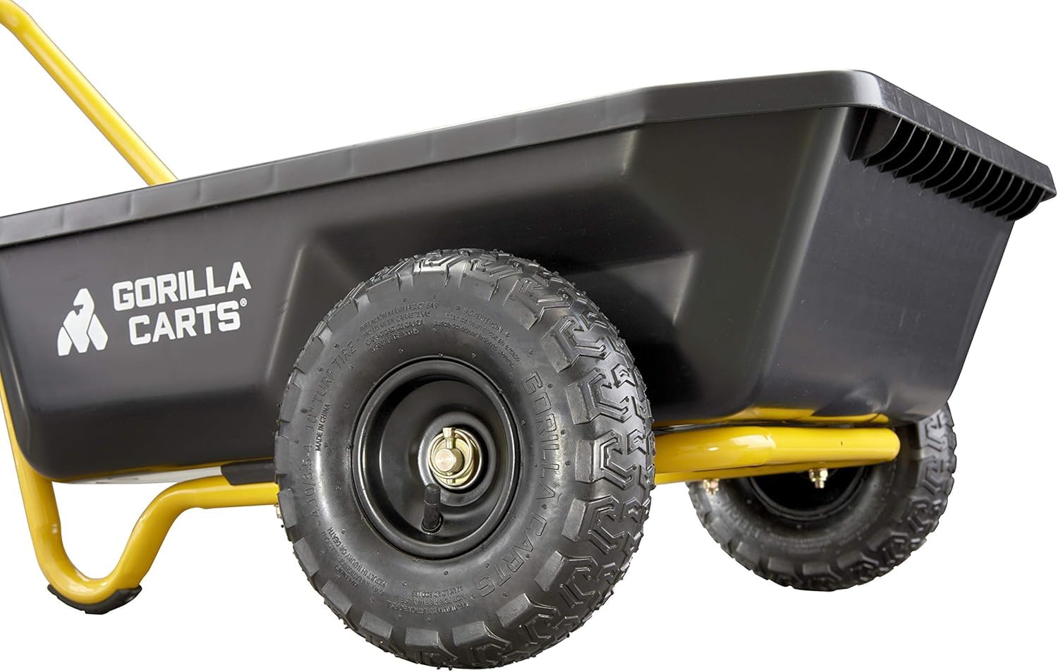 Gorilla Carts next to a person for scale showing 4 cu ft capacity and 300 lb load capacity