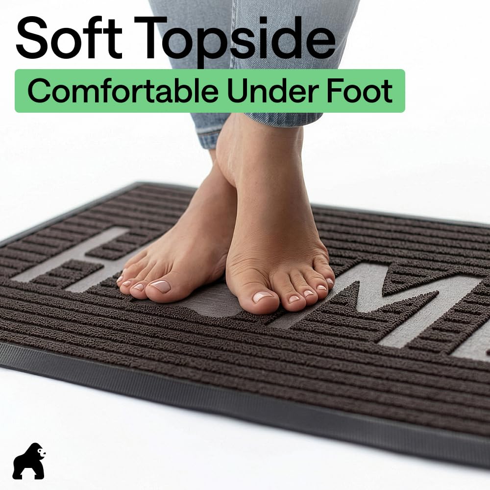GORILLA GRIP rinsing mud off mat showing easy hose clean benefit