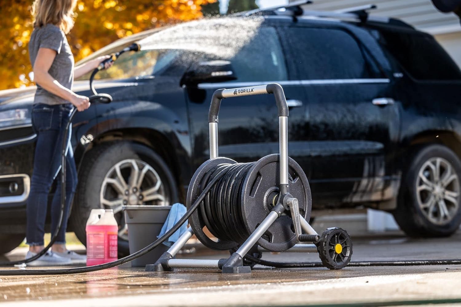 Gorilla Carts hose reel in garden setting showing practical yard use benefit
