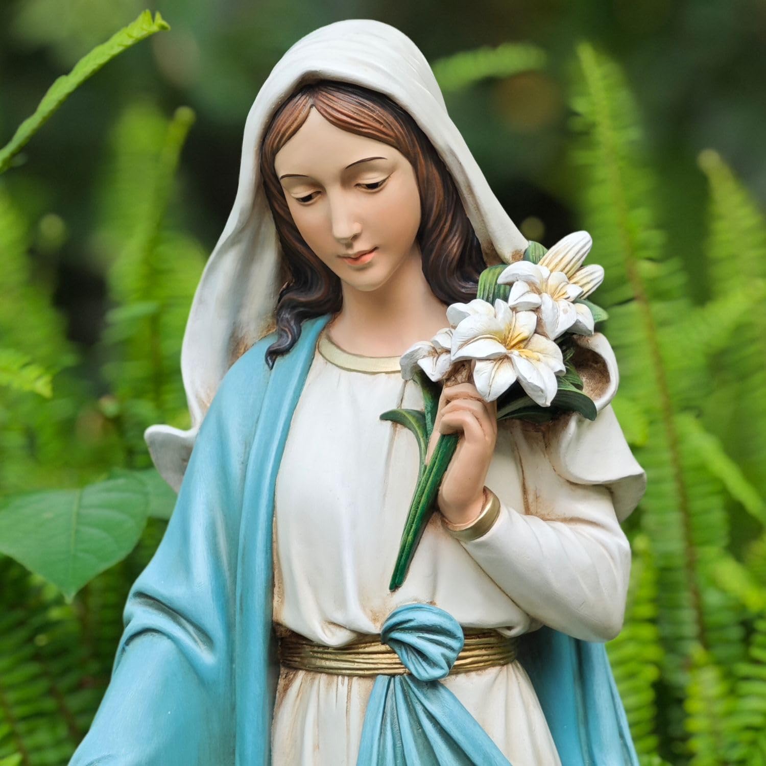 Grace4Joy close-up of Mary holding lilies highlighting delicate details and emotional calm