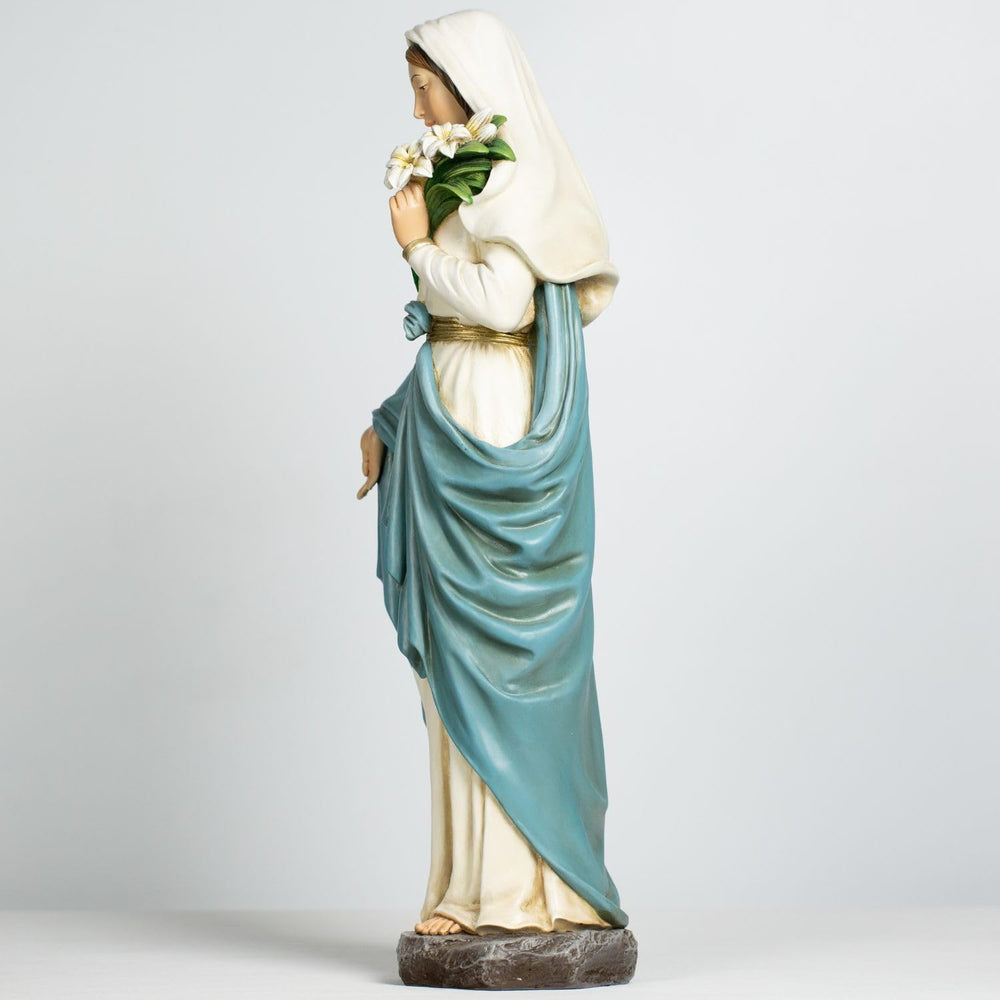 Grace4Joy statue placed in garden setting adding peaceful atmosphere and landscape charm