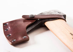Gränsfors Bruks axe head close-up showing forge marks and edge, highlighting durability and sharpness
