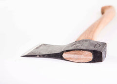 Gränsfors Bruks handle and leather sheath next to a ruler, showing compact 19-inch scale and transportability