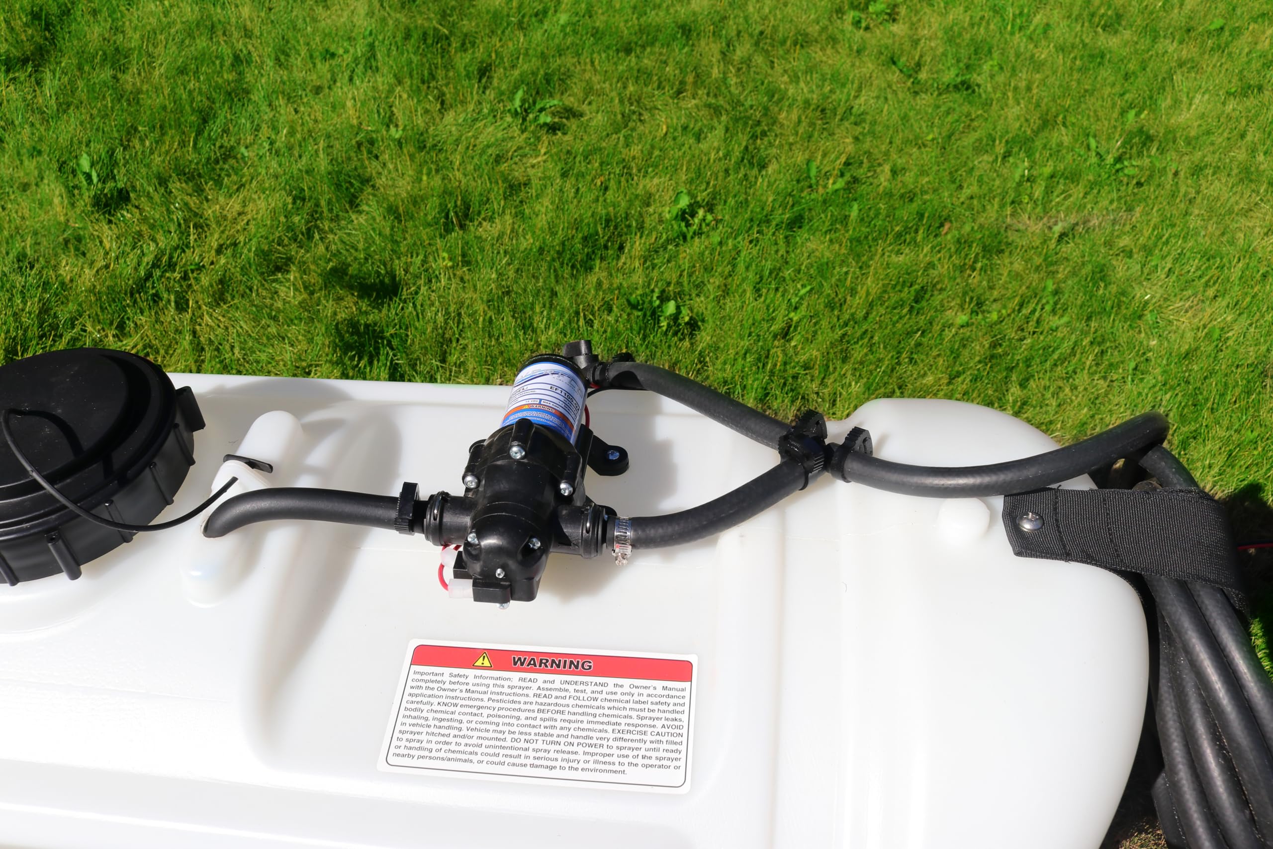 Grass Guardian broadcast boom deployed over turf showing even coverage capability
