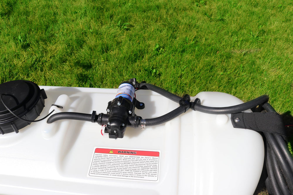Grass Guardian broadcast boom deployed over turf showing even coverage capability