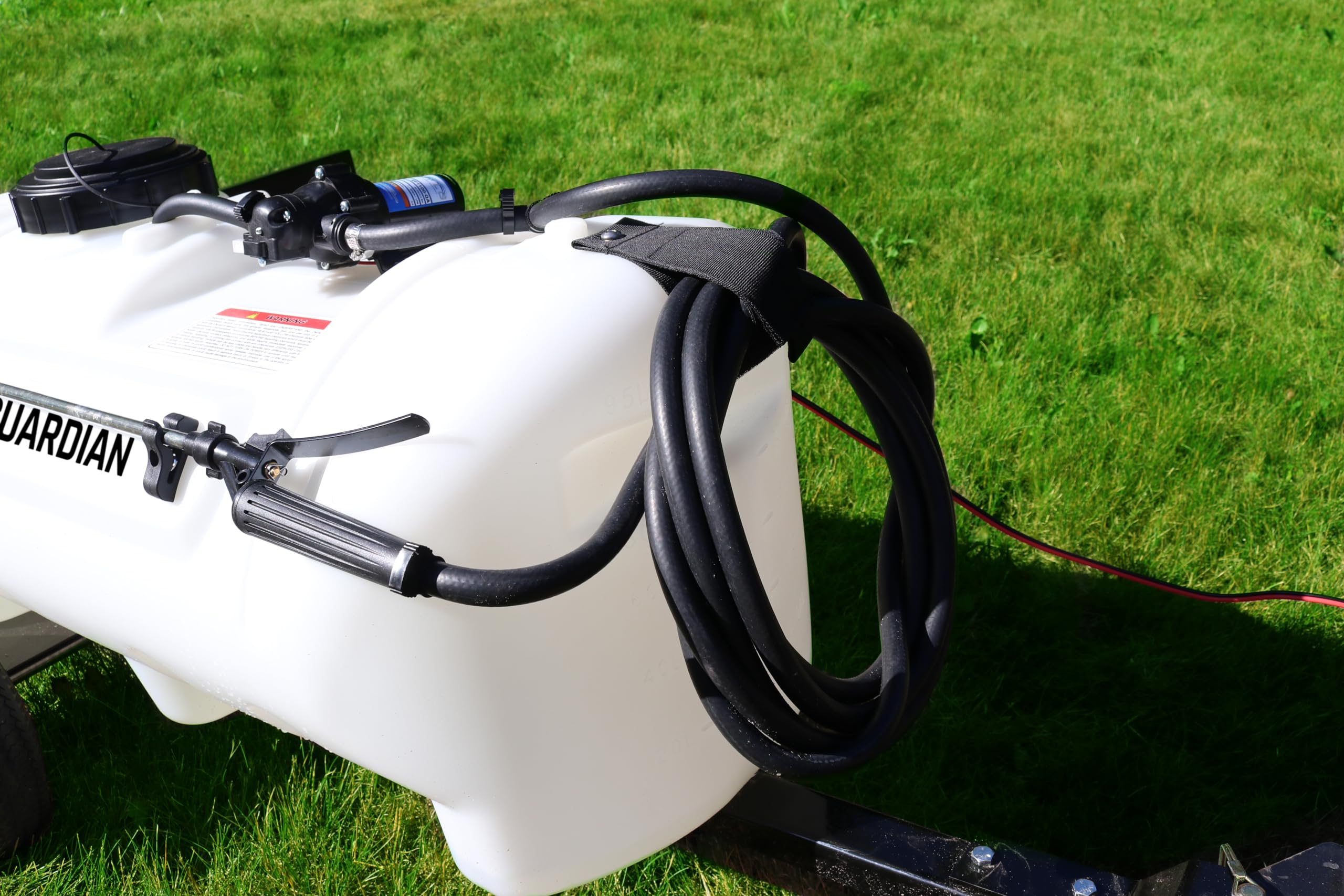 Grass Guardian translucent tank close-up with raised volume markings for accurate mixing