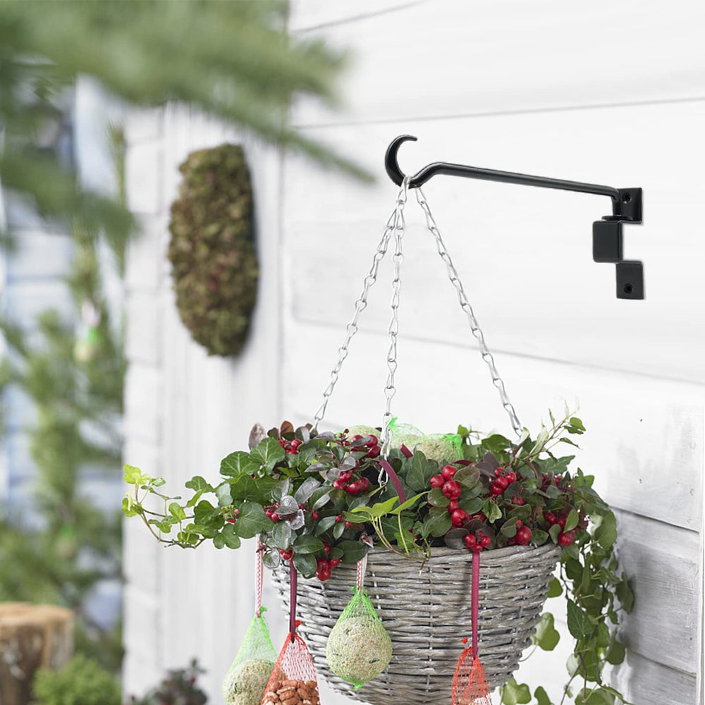 Greemov holding lantern and bird feeder illustrating versatility and durability
