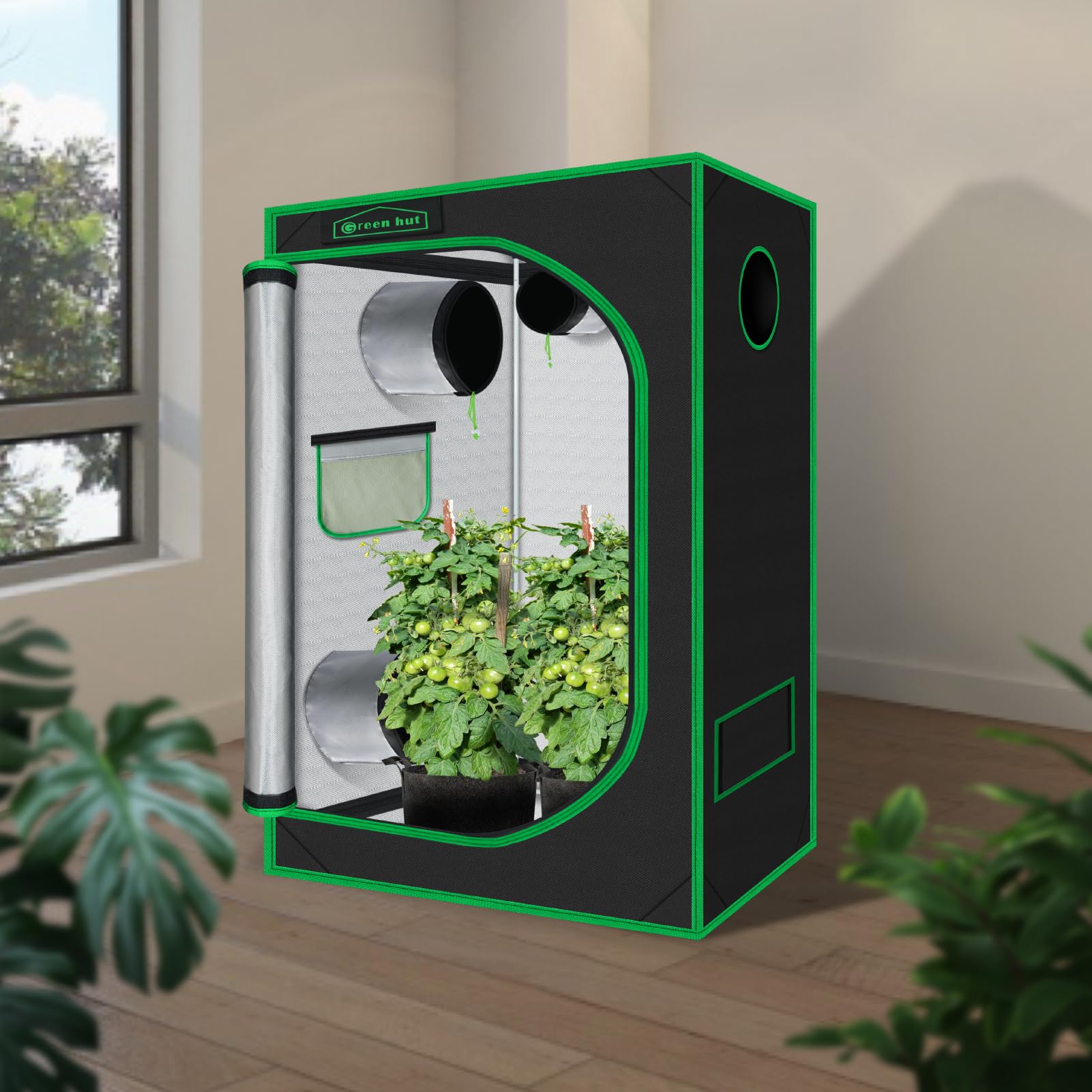 Green Hut open door revealing reflective mylar interior for improved light efficiency