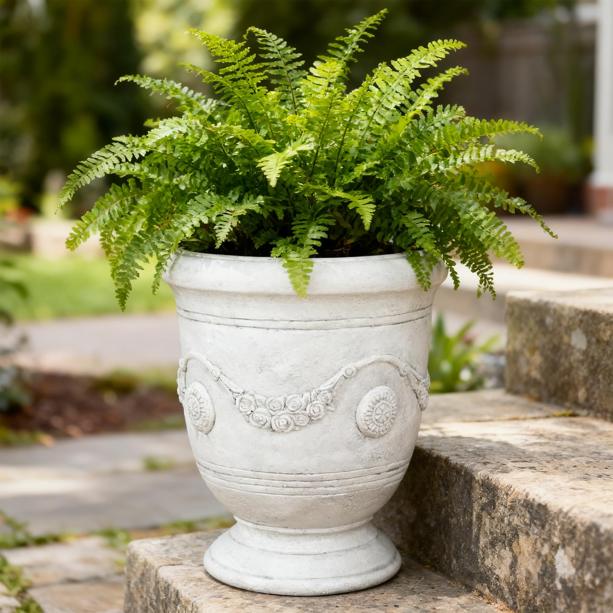 Greens Word planter filled with spring flowers demonstrating year-round display