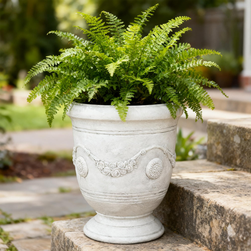 Greens Word planter filled with spring flowers demonstrating year-round display