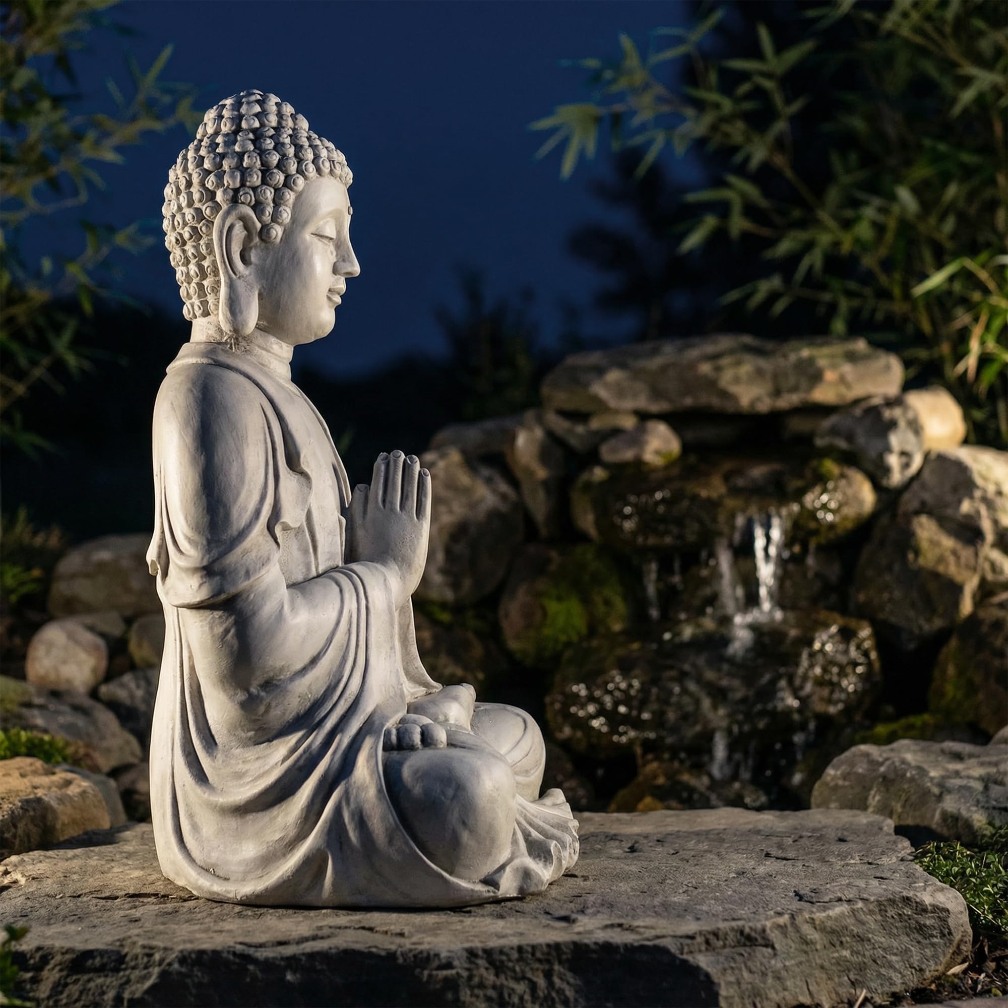 Greens Word statue placed in garden among plants offering landscape focal point benefit