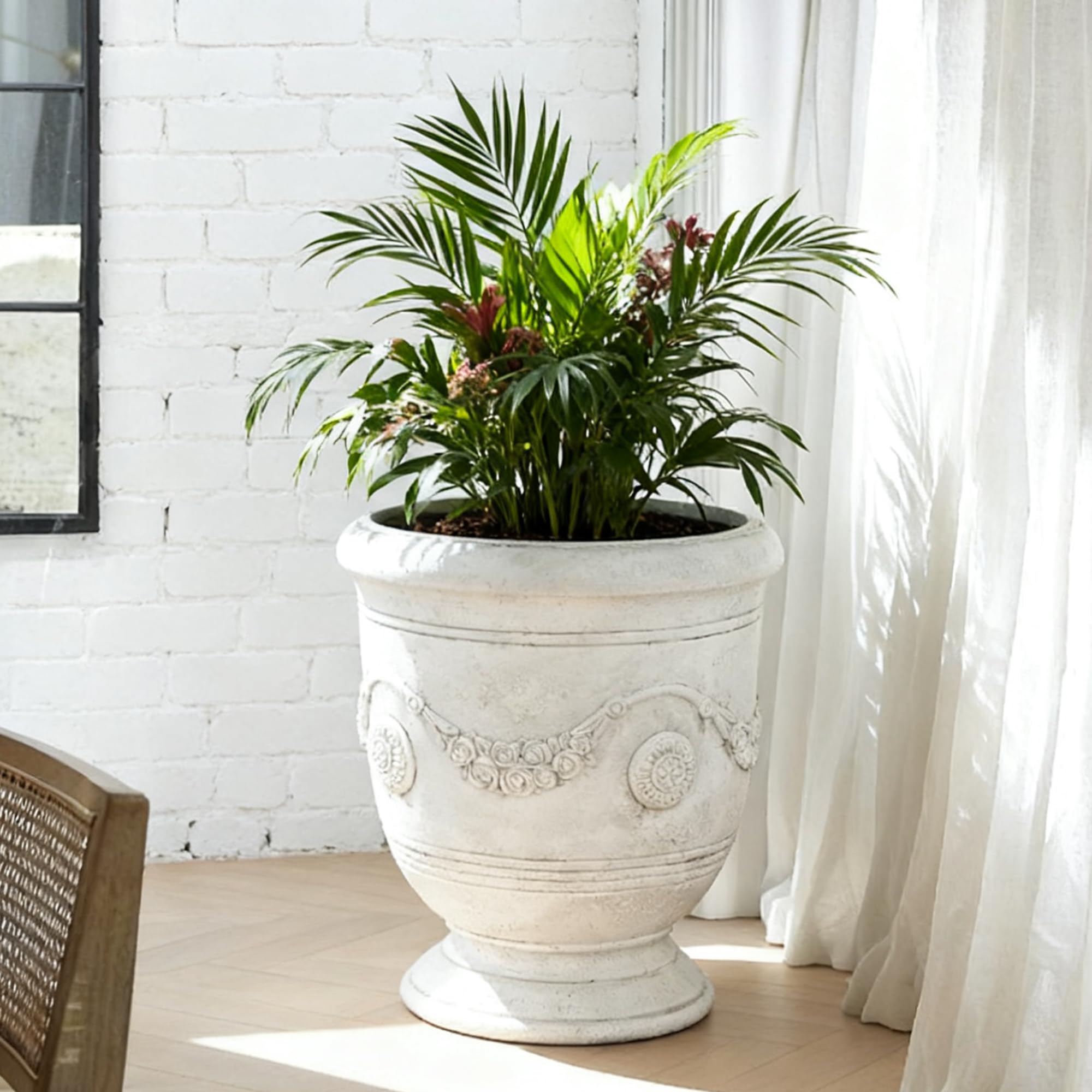 Greens Word planter on front porch arranged with seasonal plants for welcoming entrance
