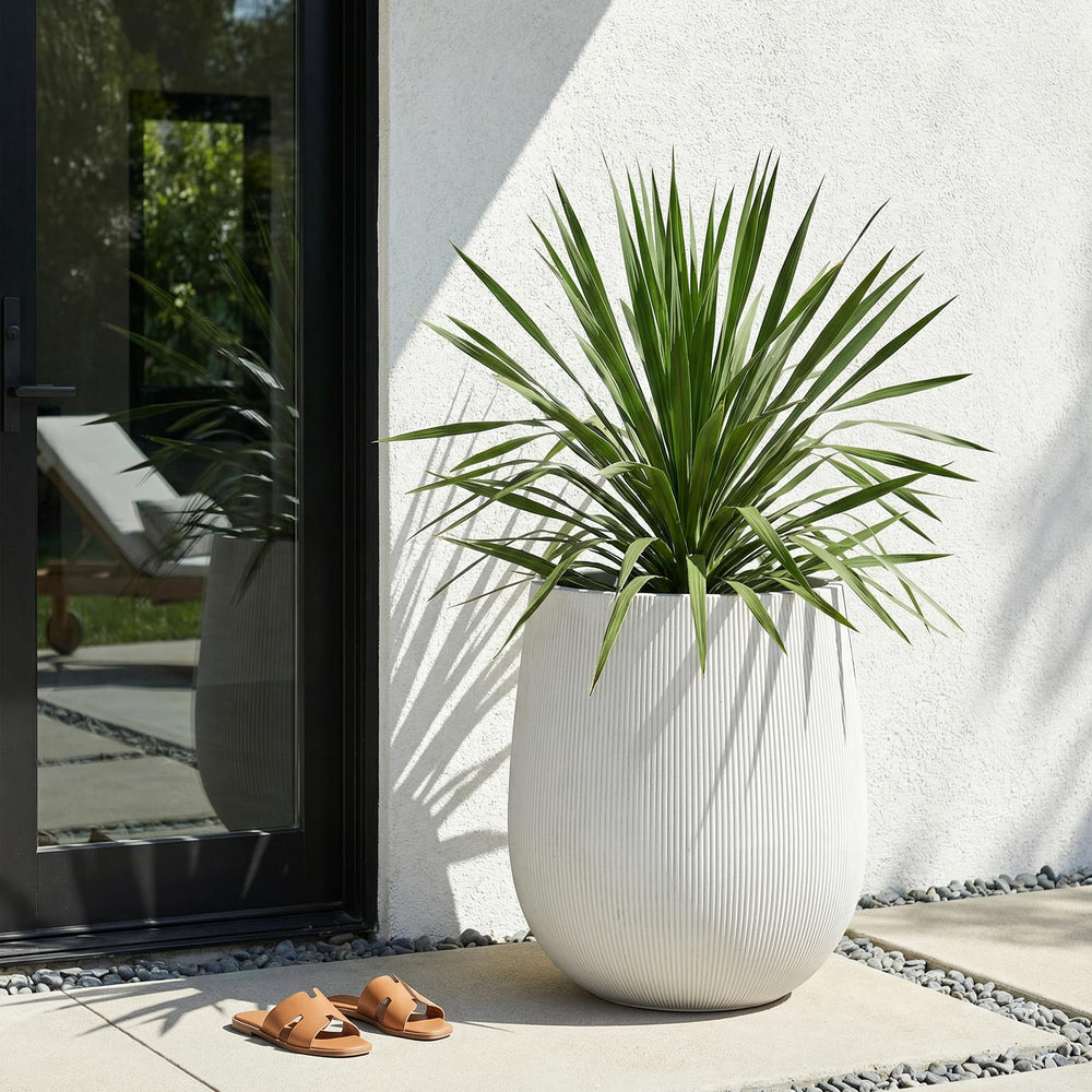 Greens Word planter on patio in lifestyle scene boosting décor and outdoor greenery