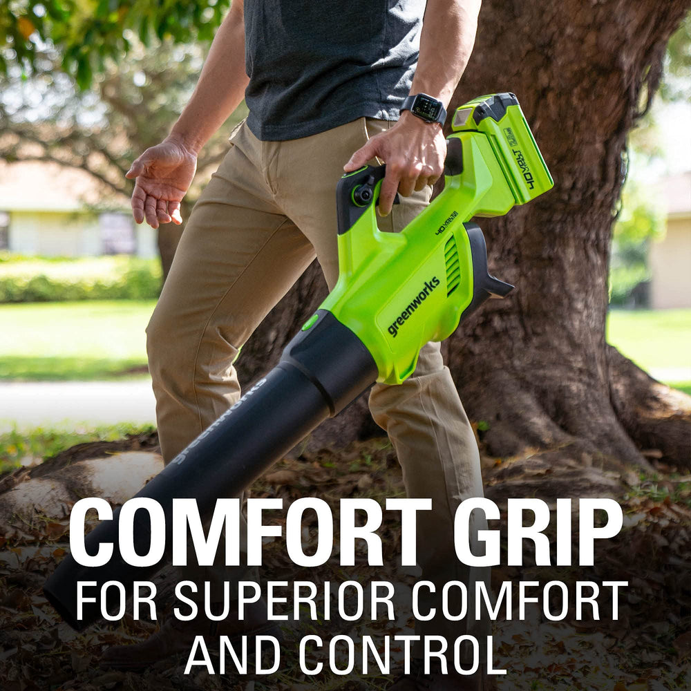Greenworks blower held in hand demonstrating compact size and maneuverability