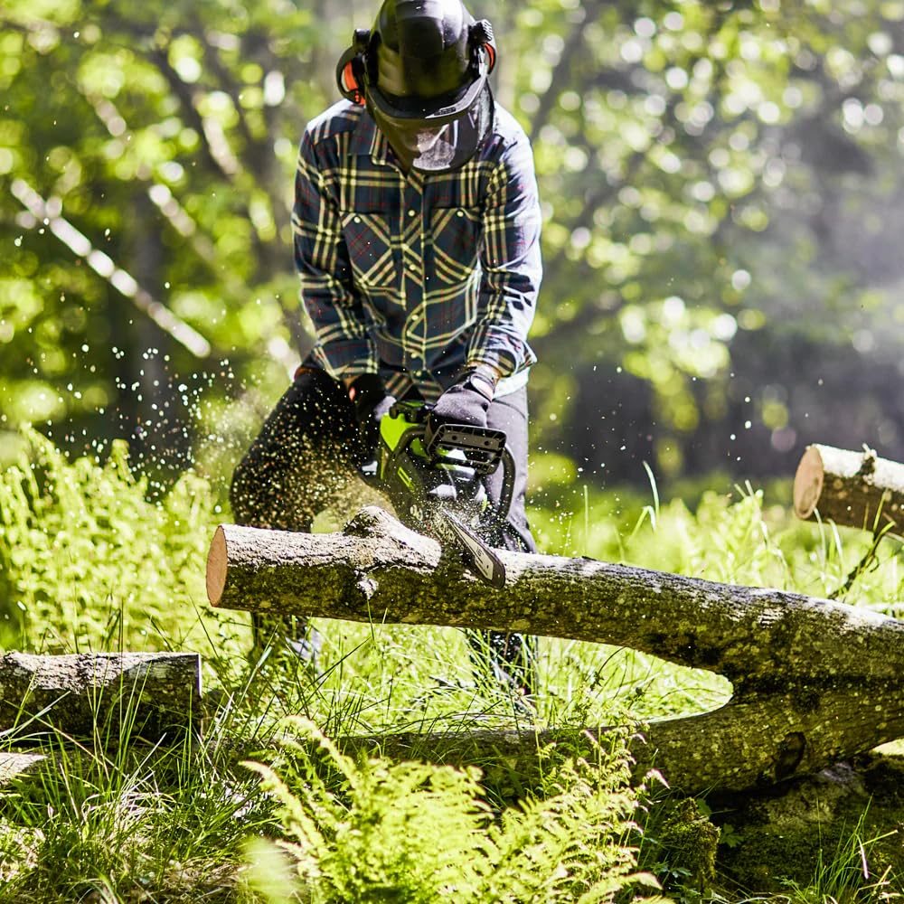 Greenworks 60V lifestyle shot in a yard highlighting quiet, fume-free use