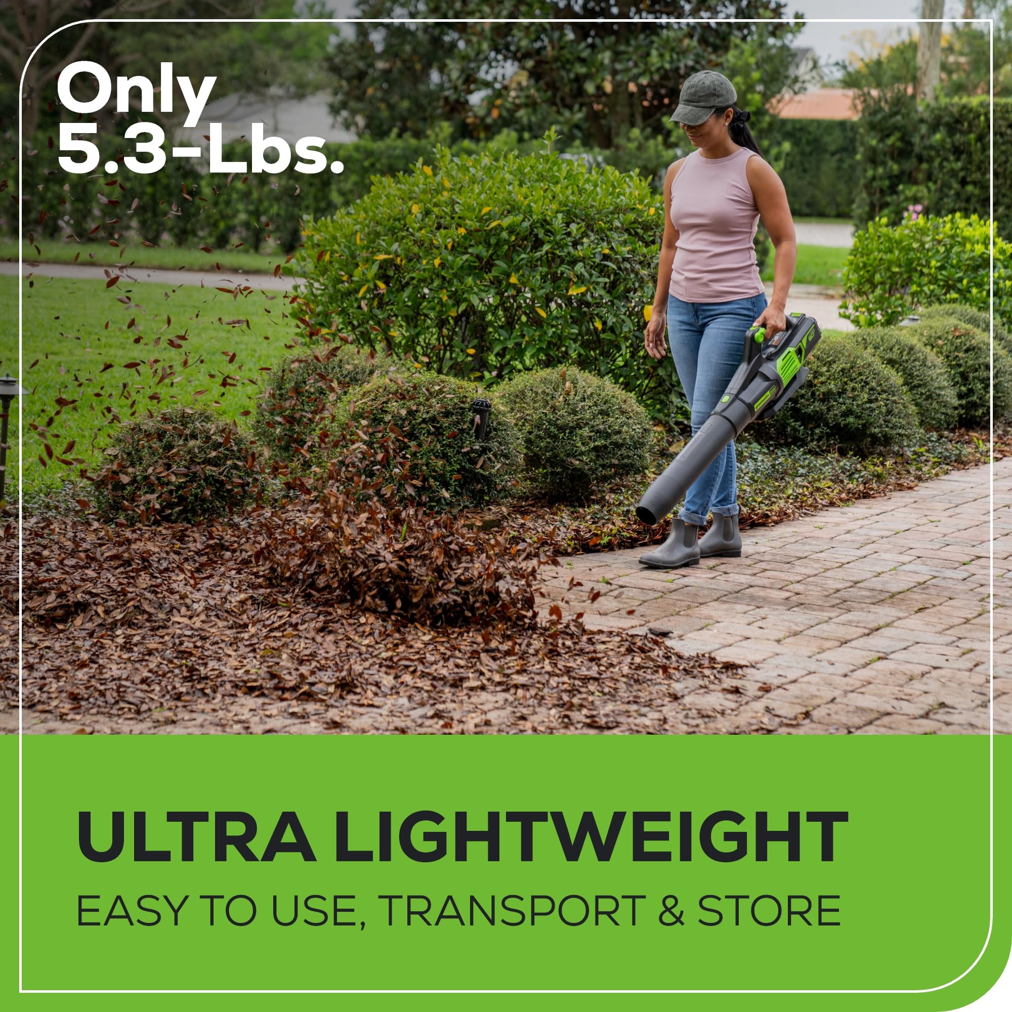 Greenworks blower in use clearing driveway showing efficient results