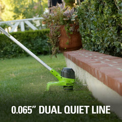 Greenworks trimmer in use edging a sidewalk for precise border control