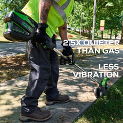 Greenworks in use edging driveway illustrating powered cordless performance and clean borders