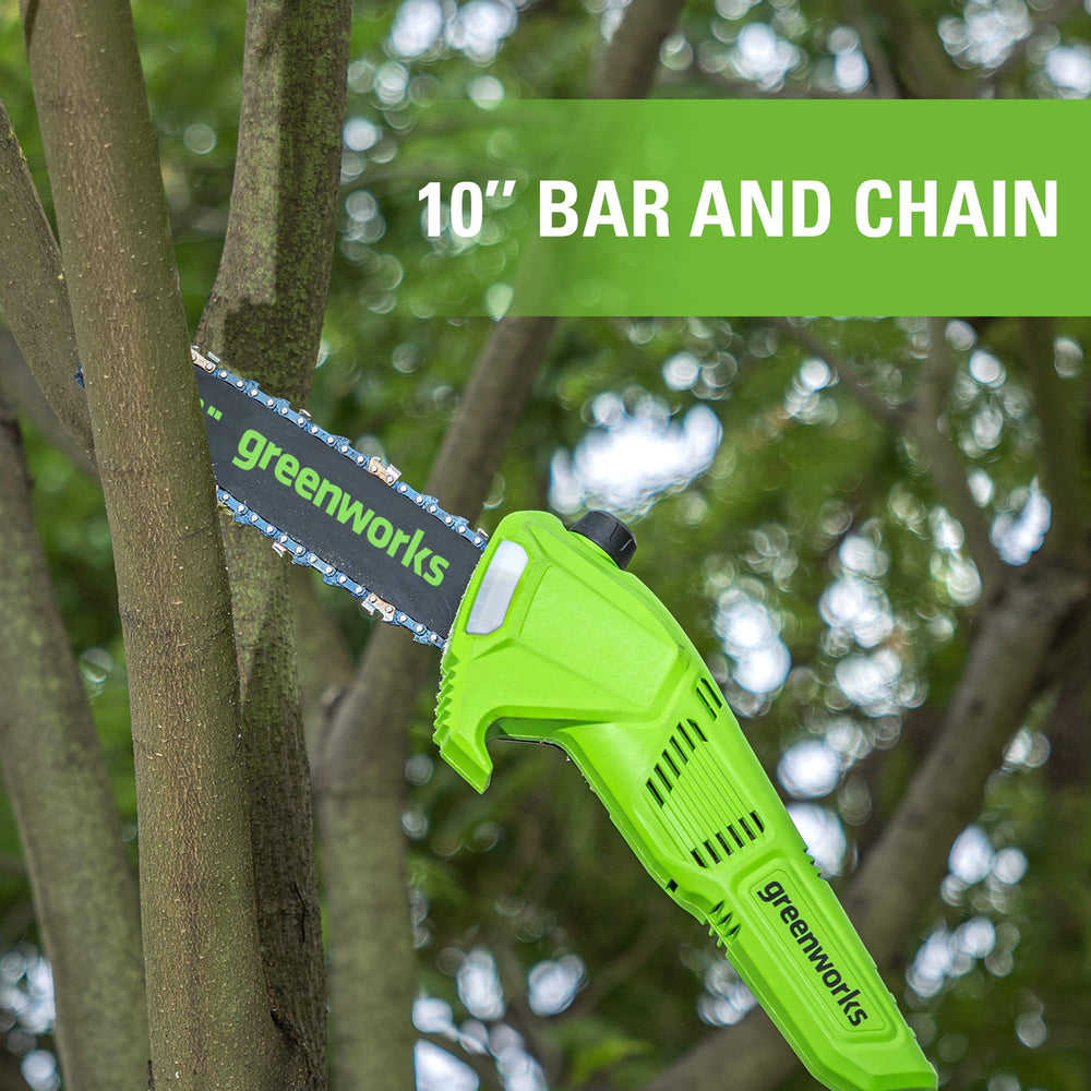 Greenworks polesaw in use pruning a tree branch from the ground for safer cutting