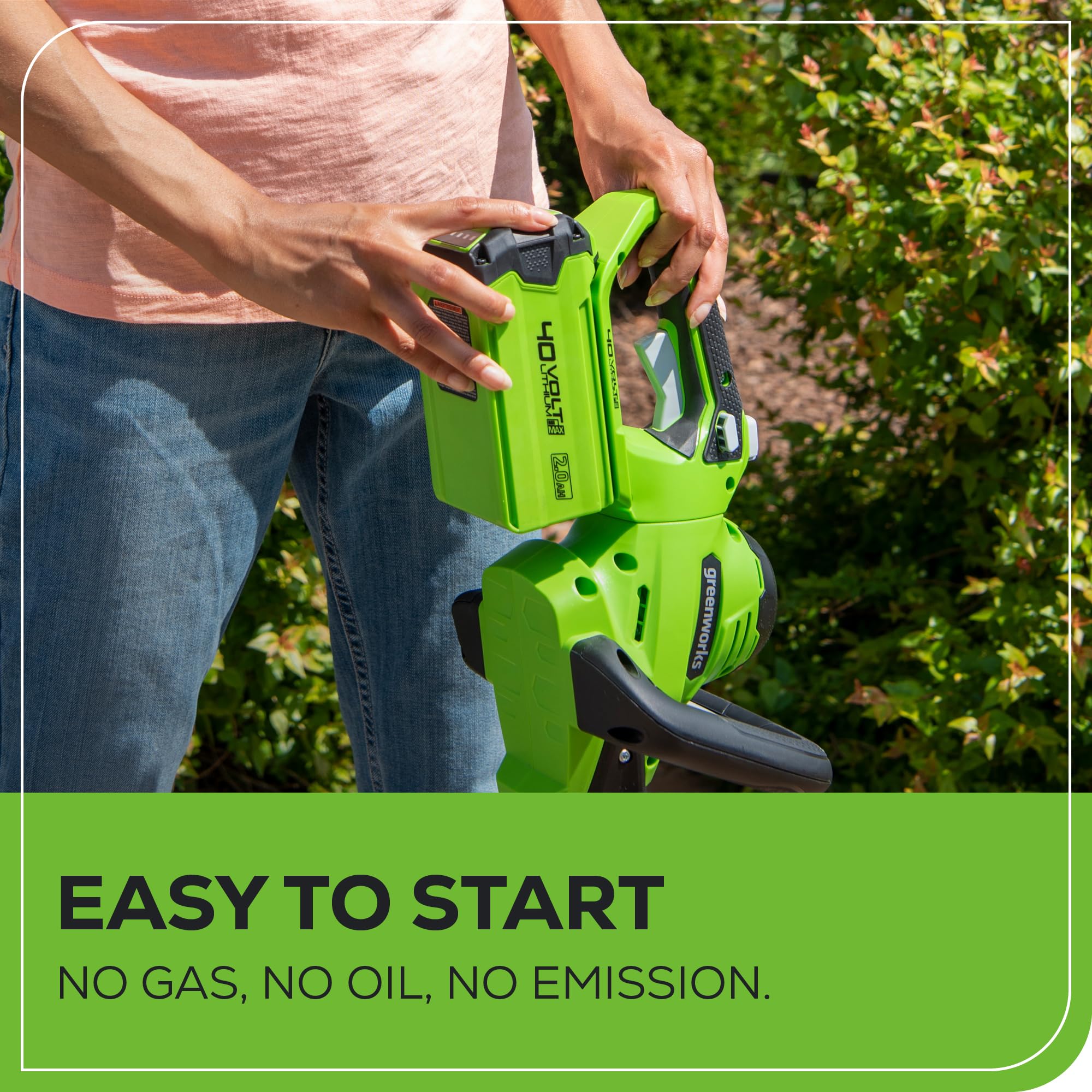 Greenworks trimmer in use on a hedge demonstrating efficient, low-noise operation