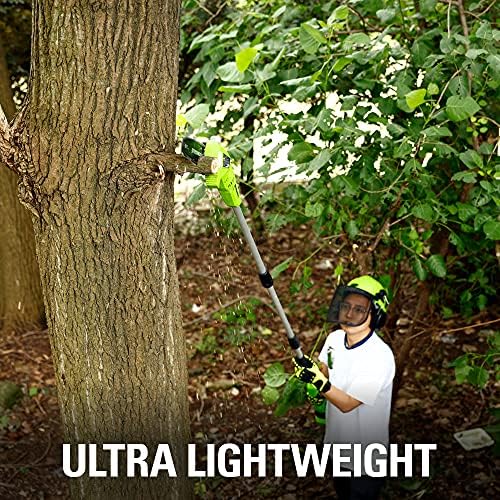 Greenworks polesaw in use trimming a tree branch showing safer pruning